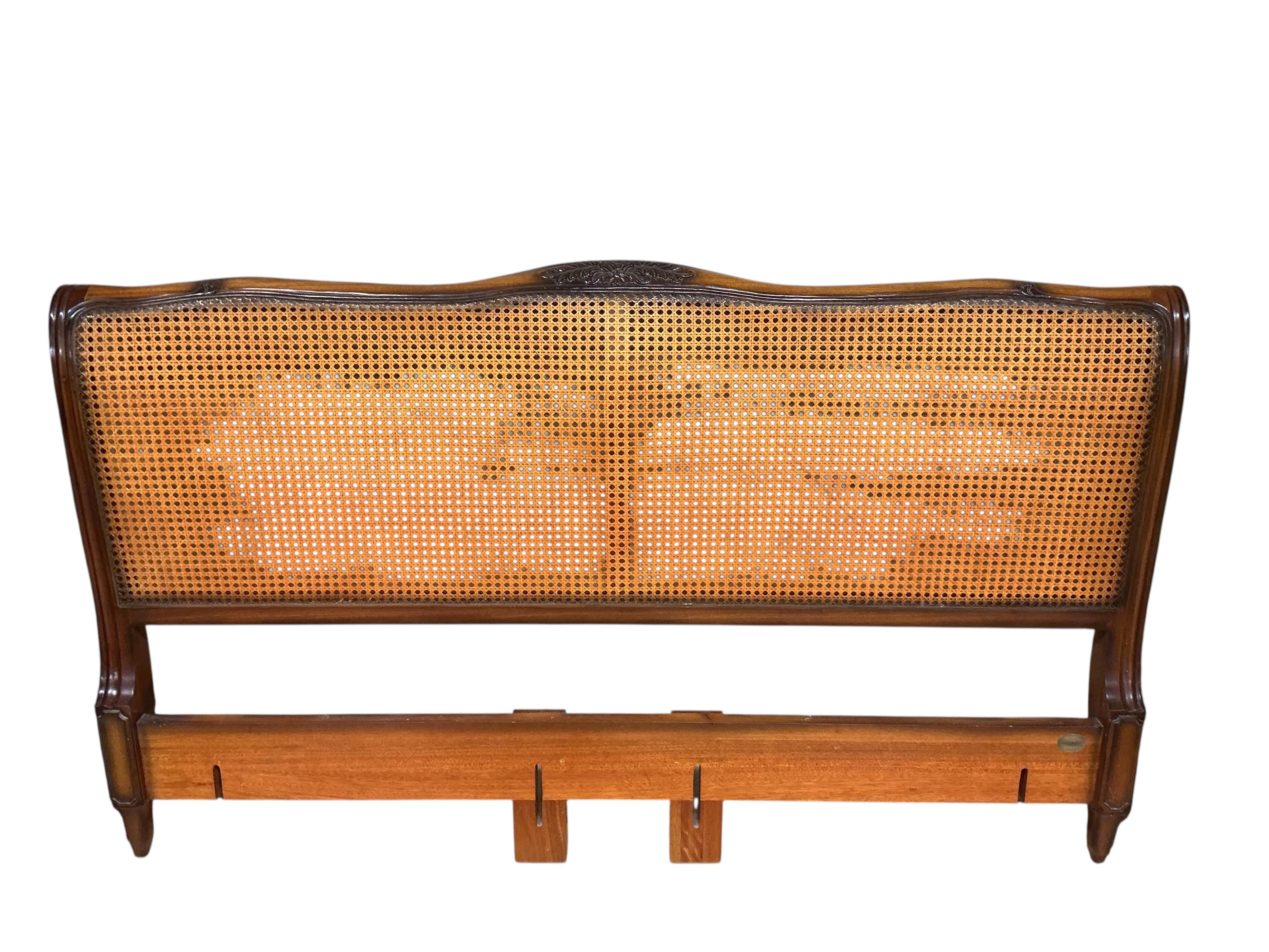 A reproduction caned walnut headboard, width 194cm